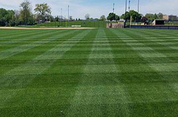 Athletic field with straight, distinct mower lines/grid